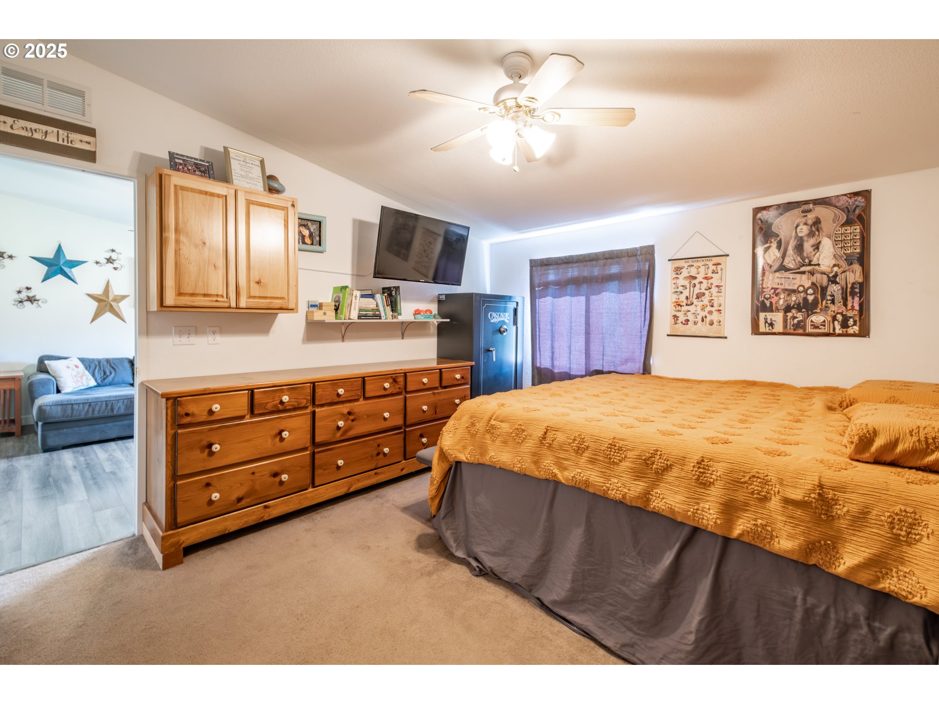 31101 Berlin Road Lebanon, OR 97355 - Photo 6 of 41 a spacious bedroom with a bed a dresser and potted plant