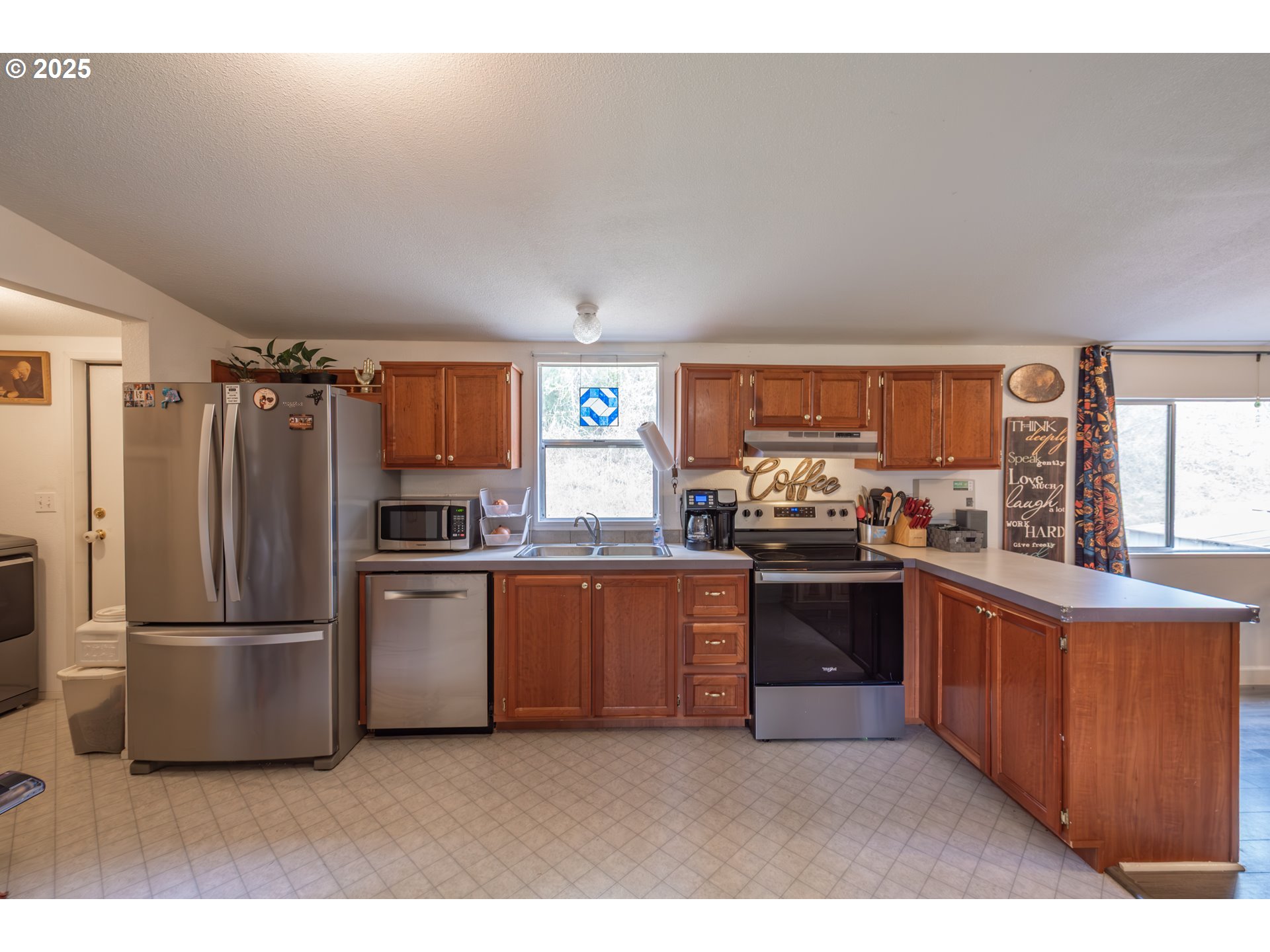 31101 Berlin Road Lebanon, OR 97355 - Photo 8 of 41 a kitchen with stainless steel appliances granite countertop a refrigerator a stove a sink and a refrigerator