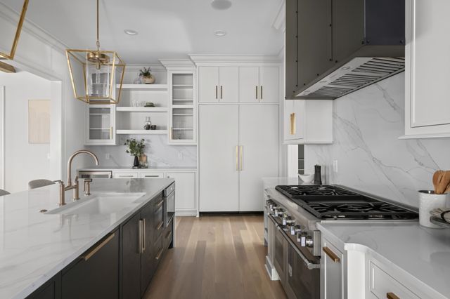 a kitchen with cabinets and wooden floor