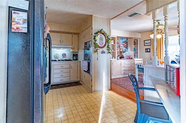 a spacious bedroom with a bed and a dresser