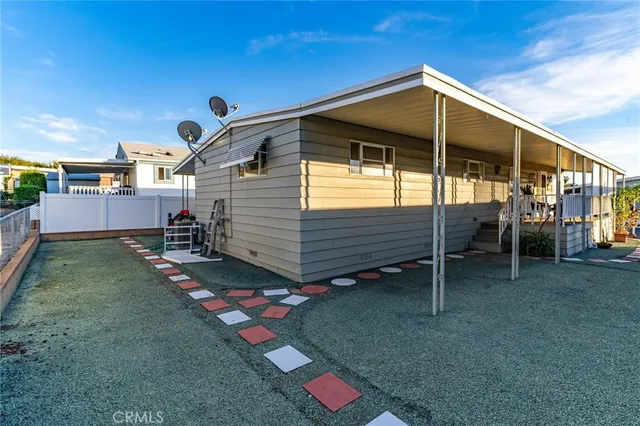 a living room with furniture or wooden floor and a flat screen tv