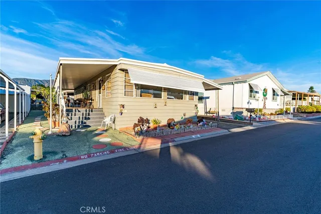 a view of a building with car parked