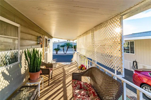 a living room with furniture a couch and a window