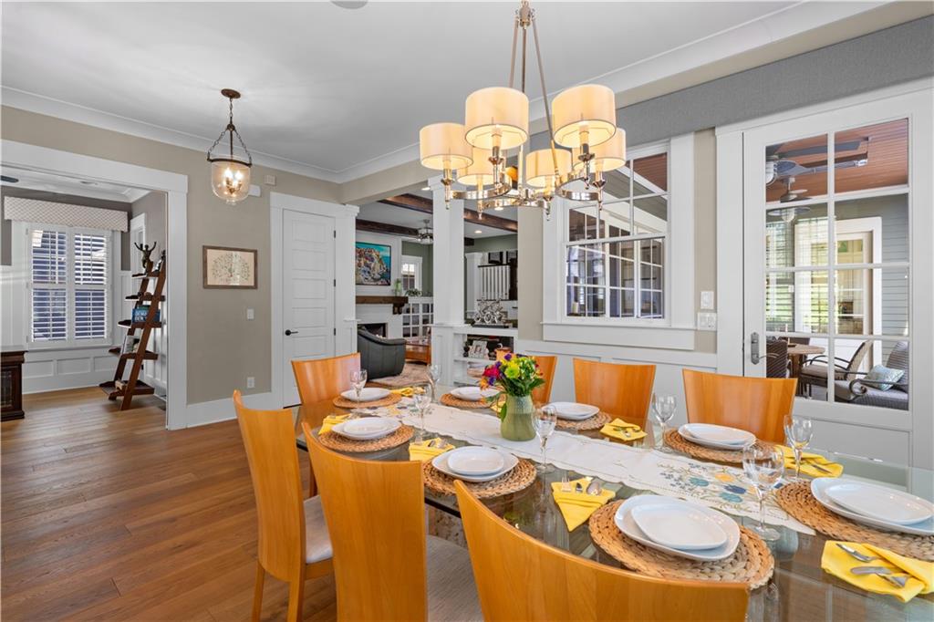 958 Austin Avenue Northeast Atlanta, GA 30307 - Photo 12 of 68 a dining room filled with furniture a chandelier and wooden floor