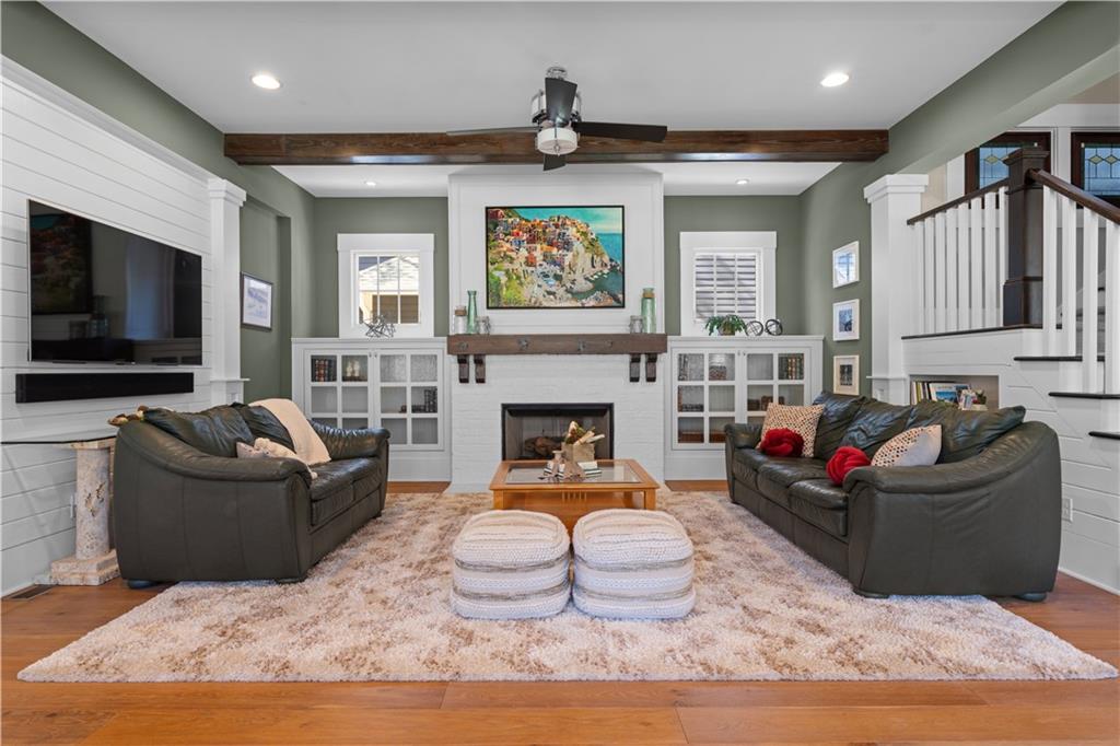 958 Austin Avenue Northeast Atlanta, GA 30307 - Photo 14 of 68 a living room with furniture a flat screen tv and a fireplace