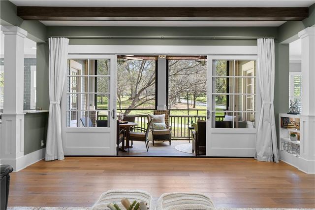 a kitchen with stainless steel appliances kitchen island granite countertop a sink refrigerator and cabinets