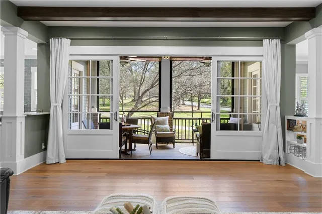 a kitchen with stainless steel appliances kitchen island granite countertop a sink refrigerator and cabinets