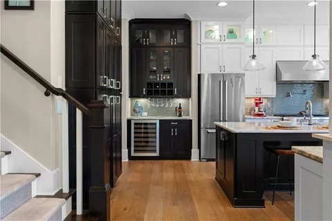 a stove top oven sitting inside of a kitchen