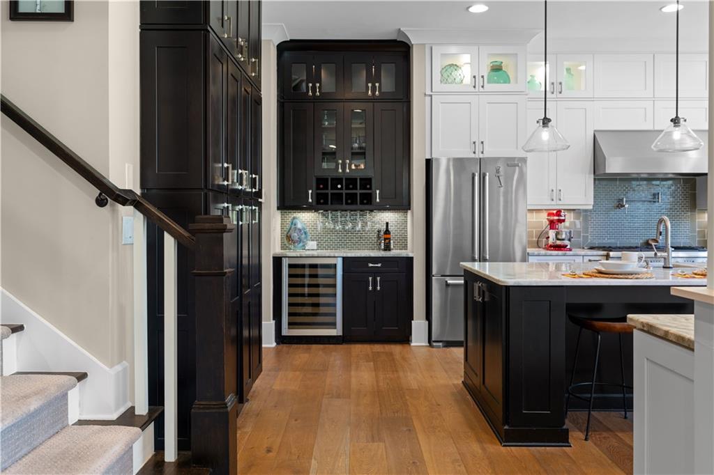 958 Austin Avenue Northeast Atlanta, GA 30307 - Photo 21 of 68 a kitchen with stainless steel appliances kitchen island wooden cabinets and stove