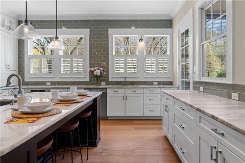 a bathroom with a sink vanity and a mirror