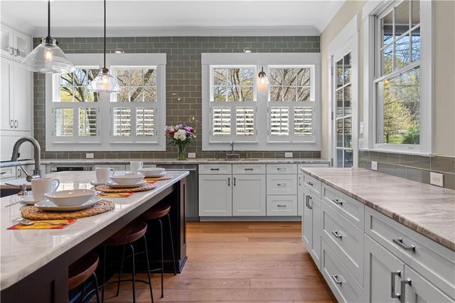 a bathroom with a sink vanity and a mirror