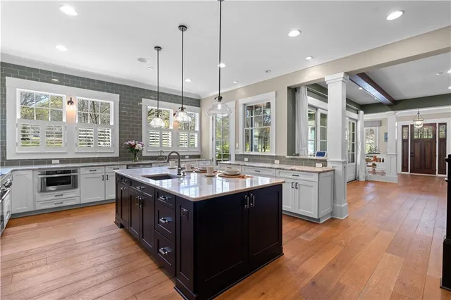 a kitchen with a sink and cabinets