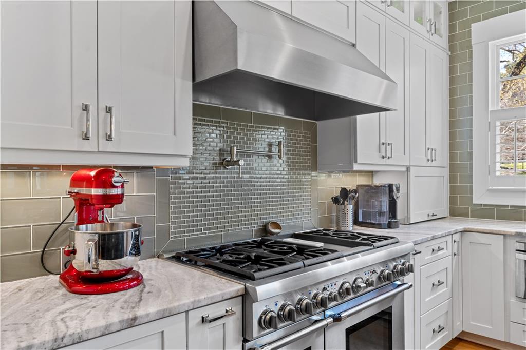958 Austin Avenue Northeast Atlanta, GA 30307 - Photo 27 of 68 a stove top oven sitting inside of a kitchen