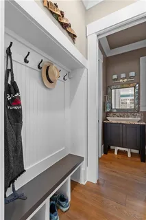 a spacious bathroom with a tub a double vanity sink a mirror and a tub