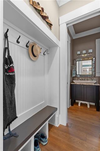 a spacious bathroom with a tub a double vanity sink a mirror and a tub