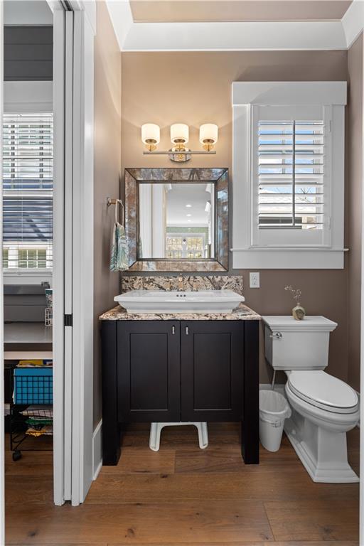 958 Austin Avenue Northeast Atlanta, GA 30307 - Photo 31 of 68 a bathroom with a granite countertop toilet a sink and a mirror