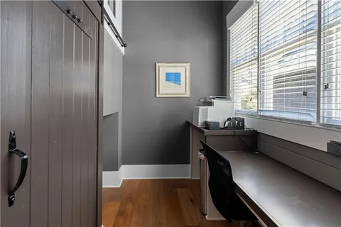 a view of walk in closet with clothes