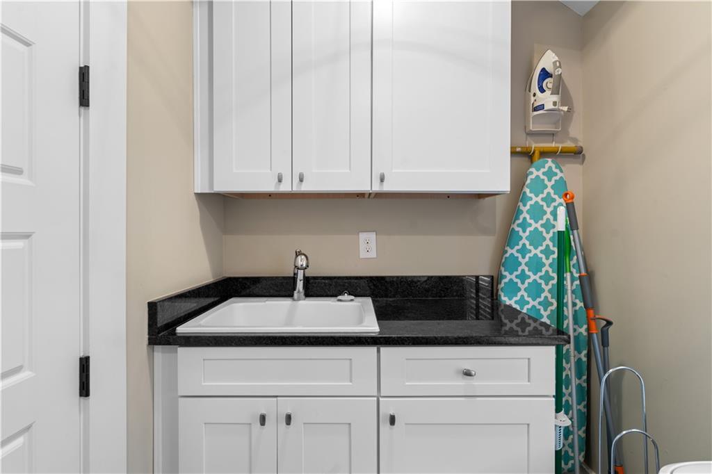 958 Austin Avenue Northeast Atlanta, GA 30307 - Photo 35 of 68 a kitchen with a sink and cabinets