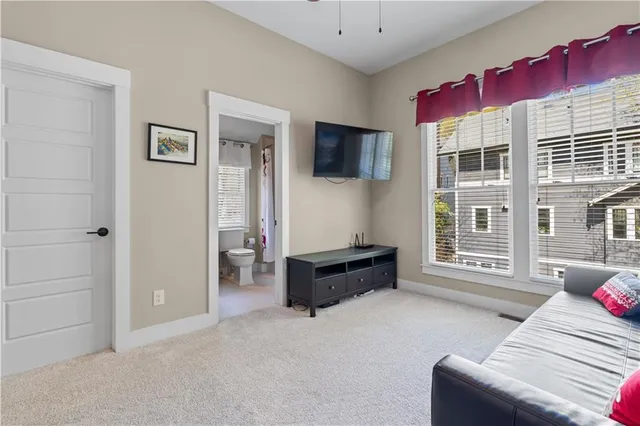 a bedroom with a bed and a television in it