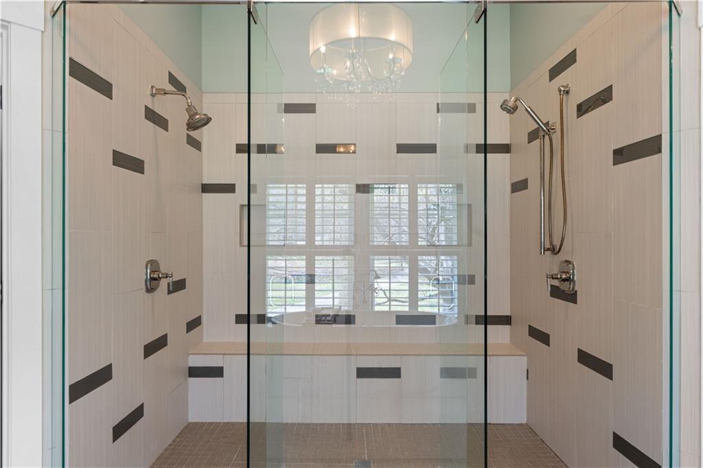 958 Austin Avenue Northeast Atlanta, GA 30307 - Photo 43 of 68 a bathroom with a bathtub and a shower