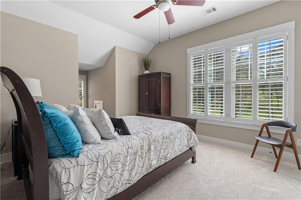 958 Austin Avenue Northeast Atlanta, GA 30307 - Photo 53 of 68 a bedroom with a large bed and a window