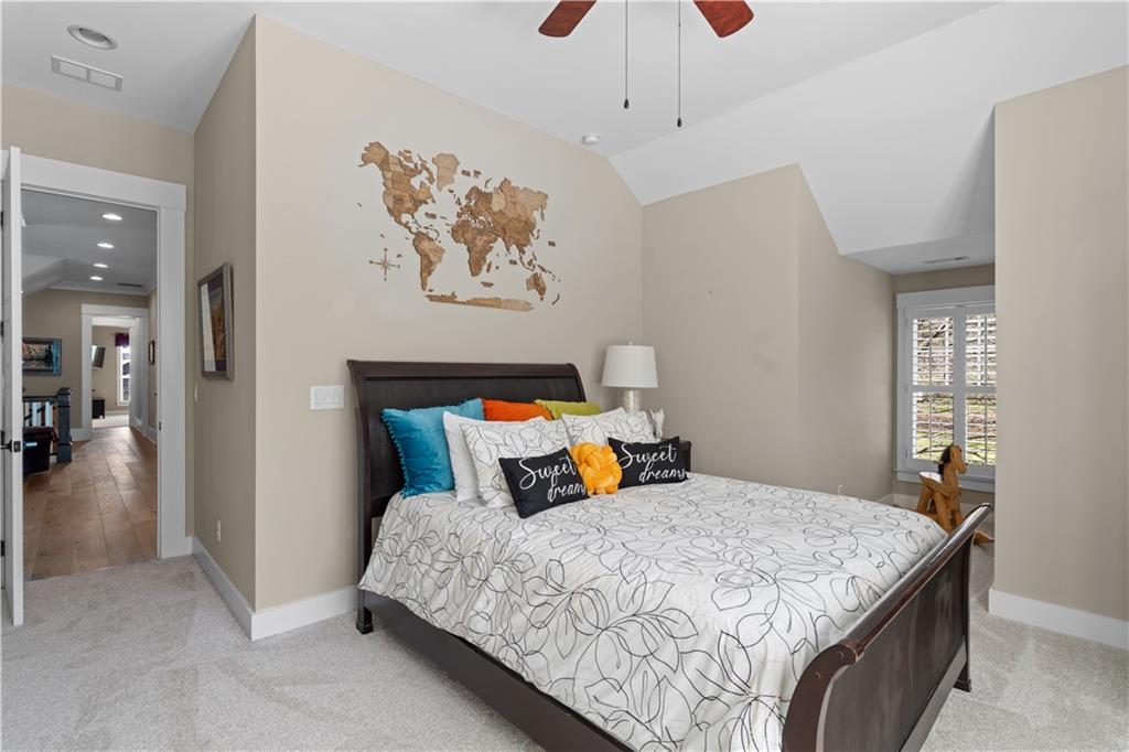 958 Austin Avenue Northeast Atlanta, GA 30307 - Photo 55 of 68 a bedroom with a bed and a chandelier