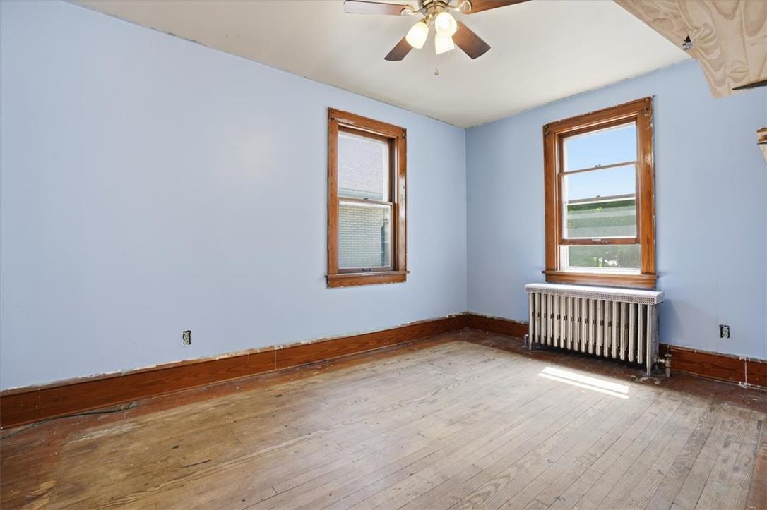 167 Main Road Lehighton, PA 18235 - Photo 22 of 41 A classic bedroom awaits your personal touch, featuring wood floors and well-maintained windows.