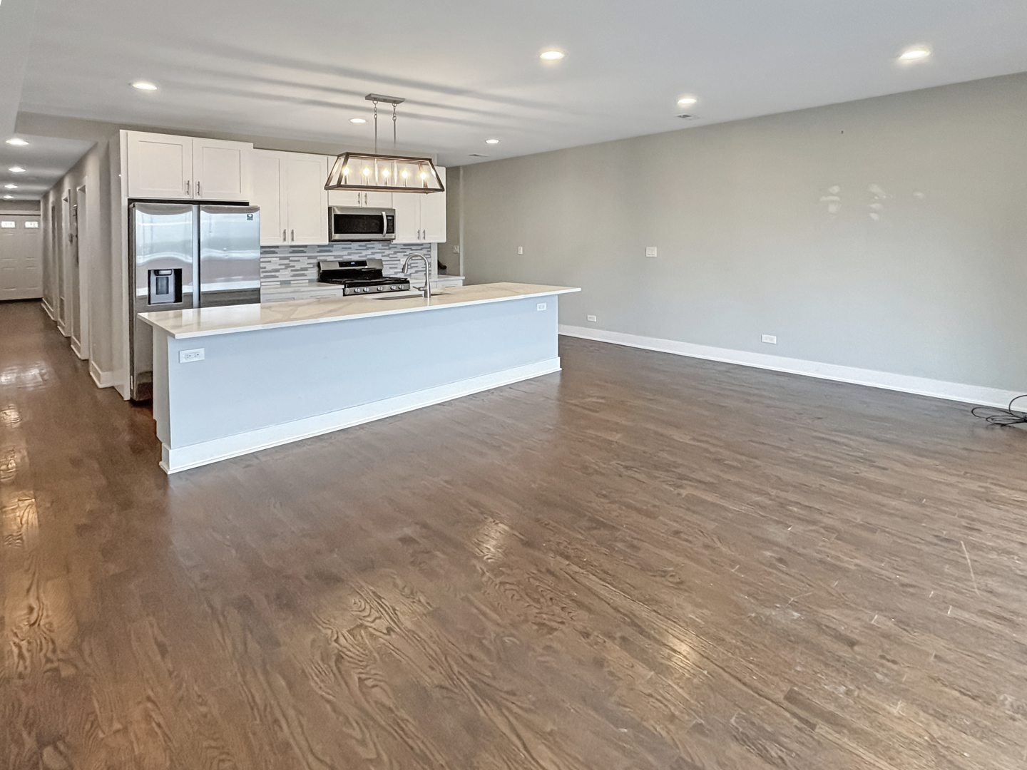 1634 West Cermak Road, Unit 3 Chicago, IL 60608 - Photo 3 of 19 a kitchen with stainless steel appliances a refrigerator sink and stove