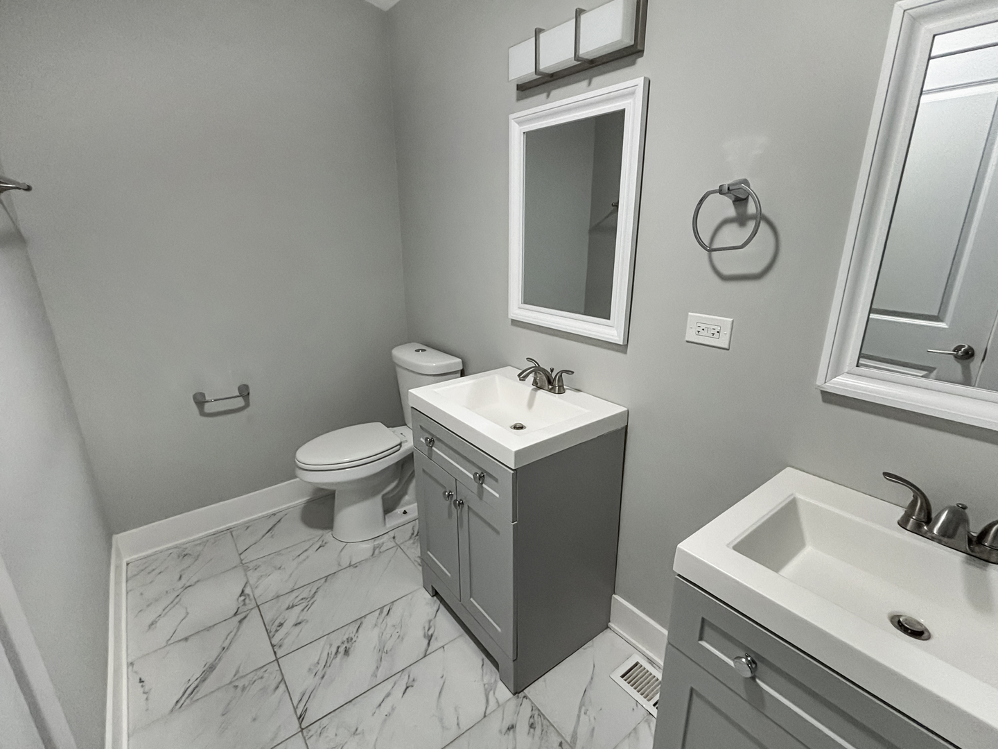 1634 West Cermak Road, Unit 3 Chicago, IL 60608 - Photo 9 of 19 a bathroom with a sink toilet and mirror