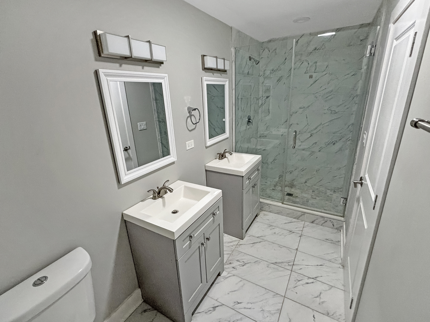 1634 West Cermak Road, Unit 3 Chicago, IL 60608 - Photo 10 of 19 a bathroom with a sink a toilet and shower