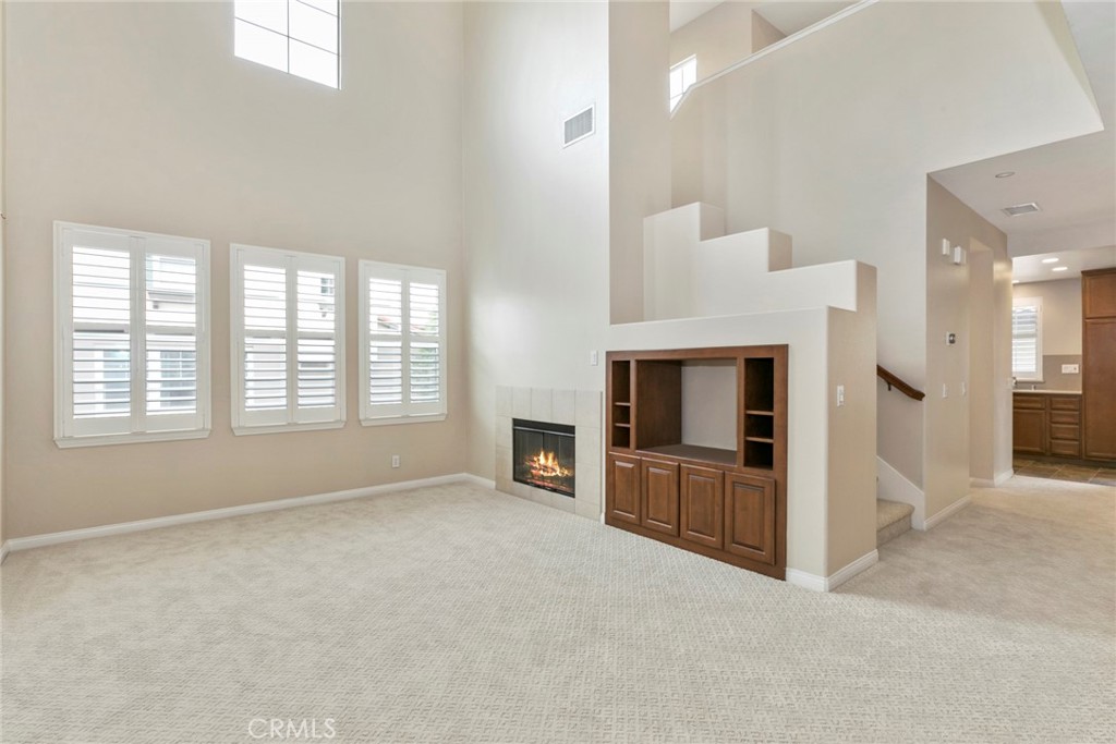 45 Perennial Irvine, CA 92603 - Photo 2 of 40 an empty room with furniture and a fireplace
