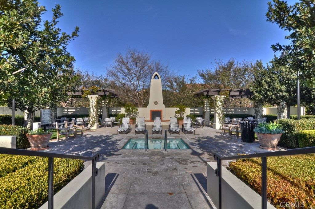 45 Perennial Irvine, CA 92603 - Photo 23 of 40 a view of a swimming pool with a patio and fire pit