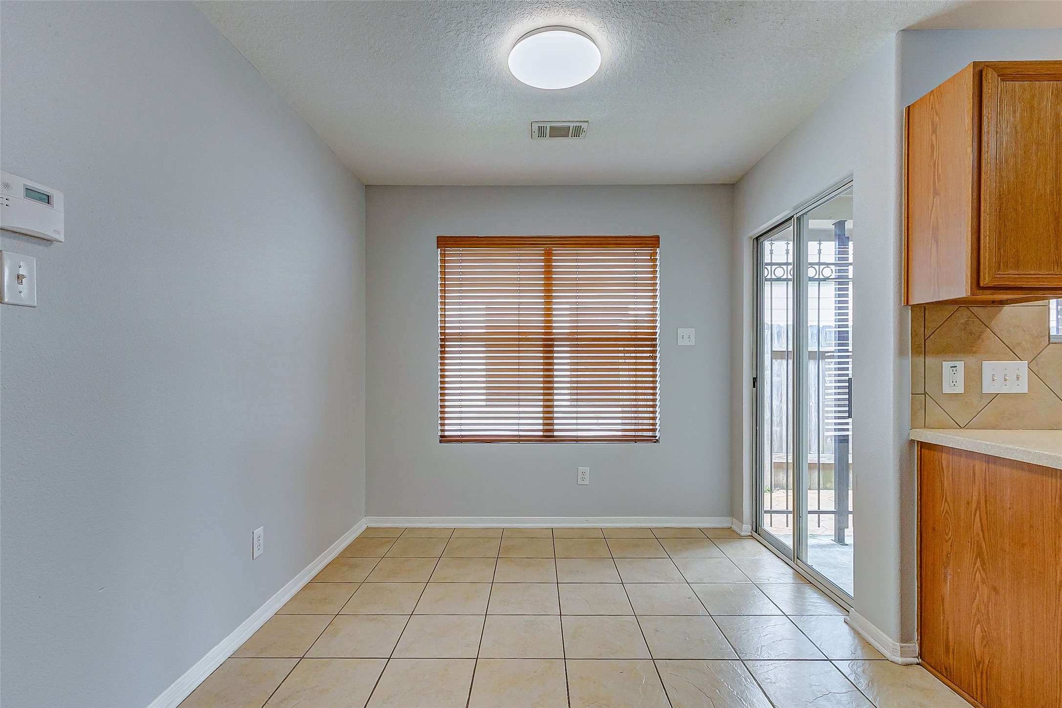 3238 Clipper Winds Way Houston, TX 77084 - Photo 8 of 21 Breakfast nook, and the doors lead you to a patio space.