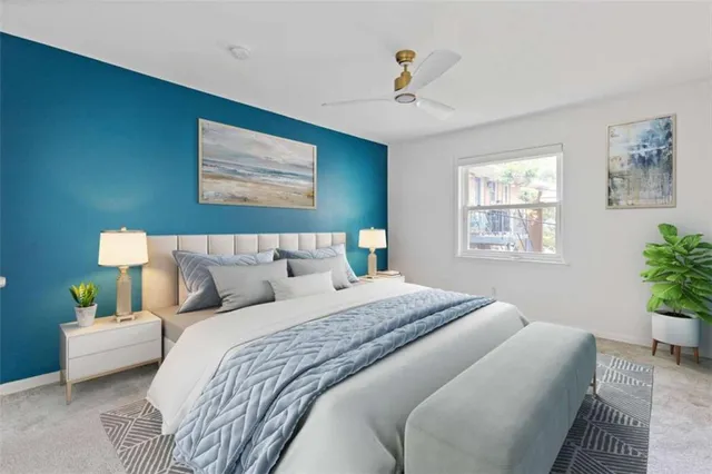 a bedroom with bed and a window