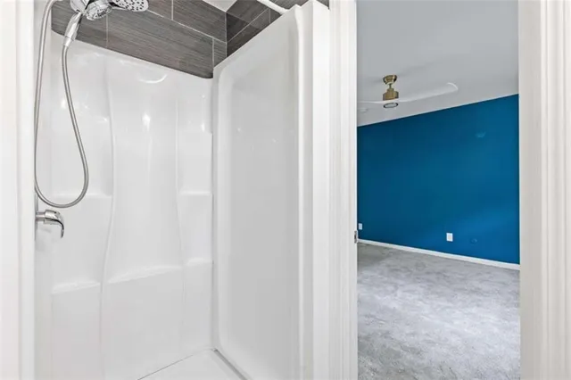 a bathroom with a glass shower door