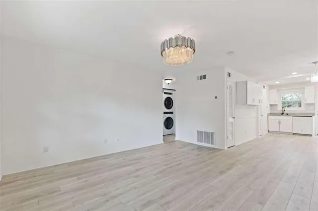 a view of a room with wooden floor and window