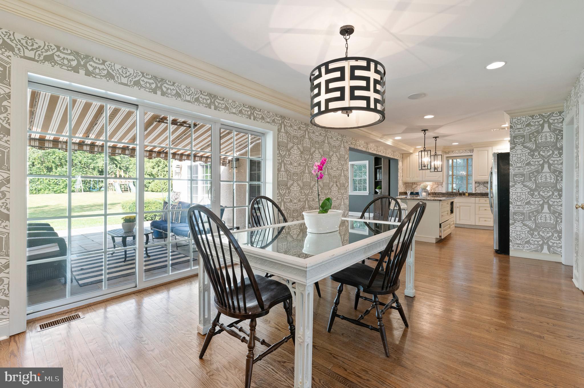 124 Tyson Road Newtown Square, PA 19073 - Photo 6 of 31 Kitchen with sliders to patio with awning covering
