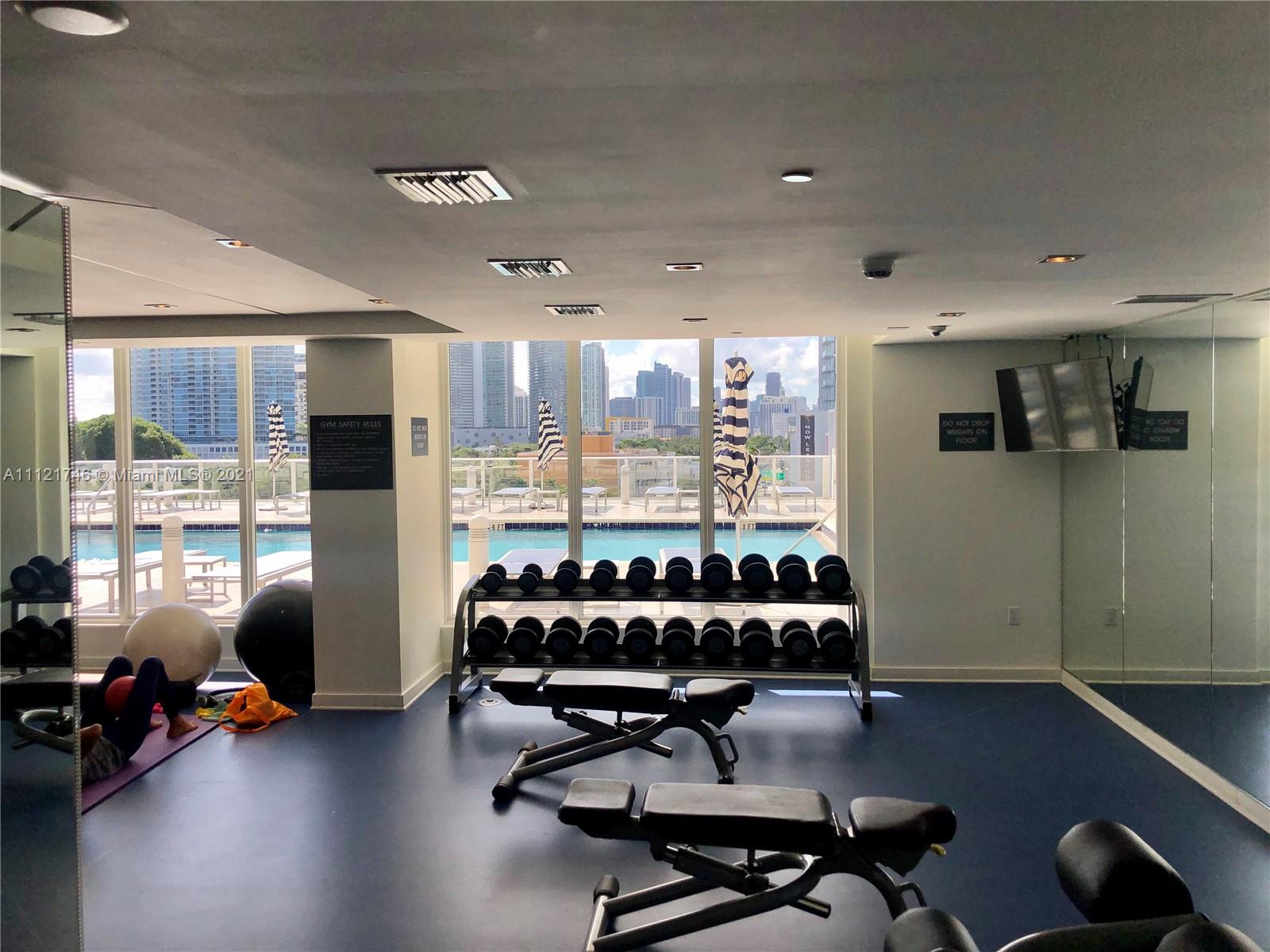4250 Biscayne Boulevard, Unit 1601 Miami, FL 33137 - Photo 15 of 18 a view of a room with gym equipment