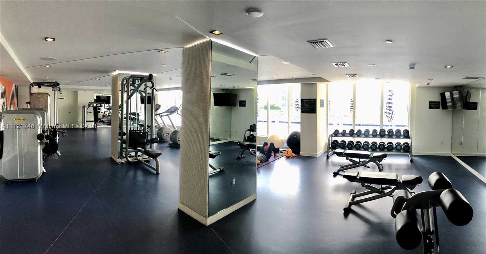 4250 Biscayne Boulevard, Unit 1601 Miami, FL 33137 - Photo 16 of 18 a view of a room with gym equipment