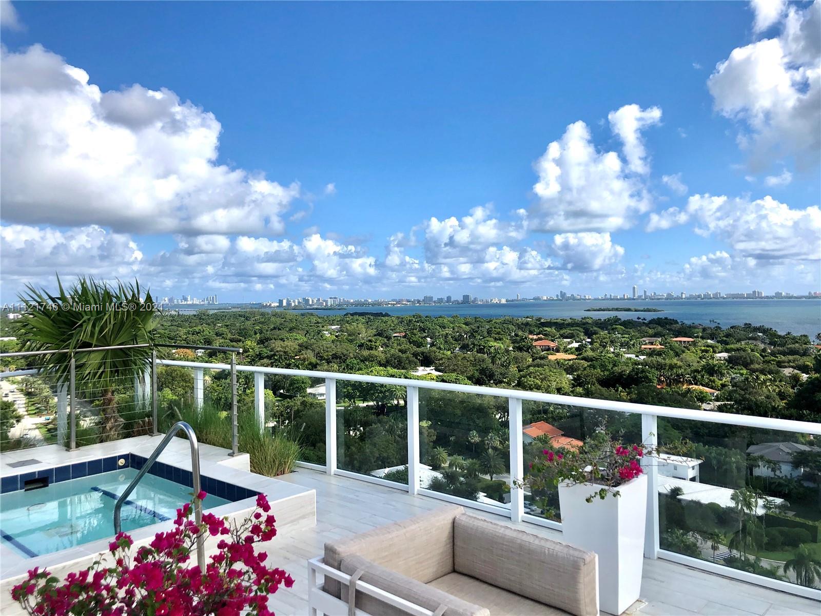 4250 Biscayne Boulevard, Unit 1601 Miami, FL 33137 - Photo 3 of 18 a view of a two chair and tables in the balcony