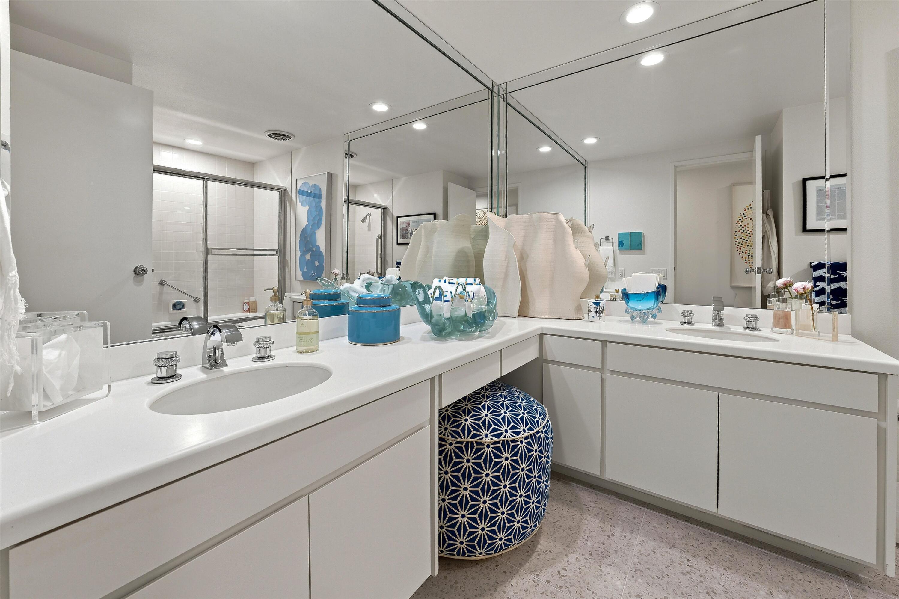 899 Island Drive, Unit 304 Rancho Mirage, CA 92270 - Photo 16 of 30 a bathroom with a sink double vanity and a mirror