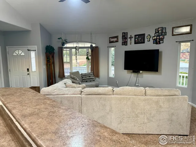 a living room with a flat screen tv and a couch