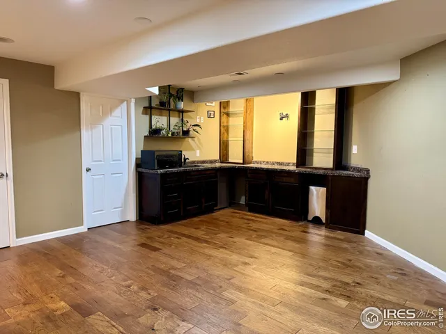 a view of kitchen with cabinets and outdoor space