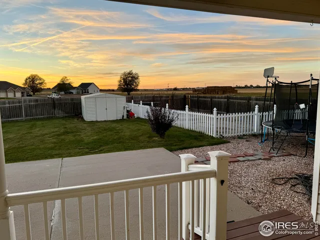 a view of a terrace with wooden fence