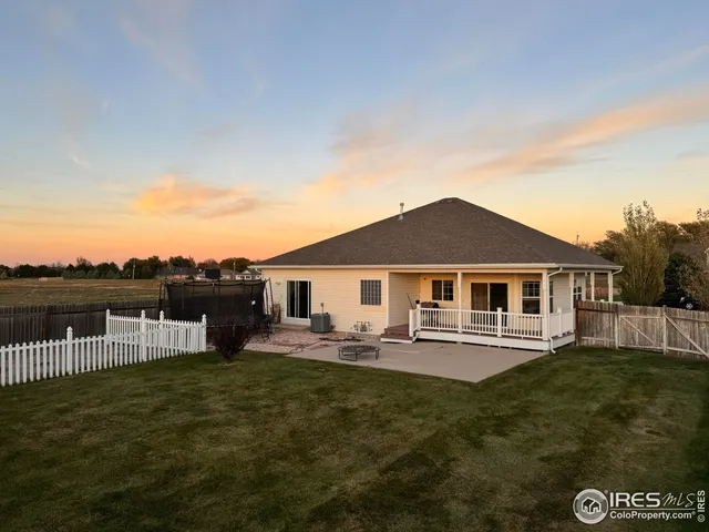a front view of a house with a garden and deck