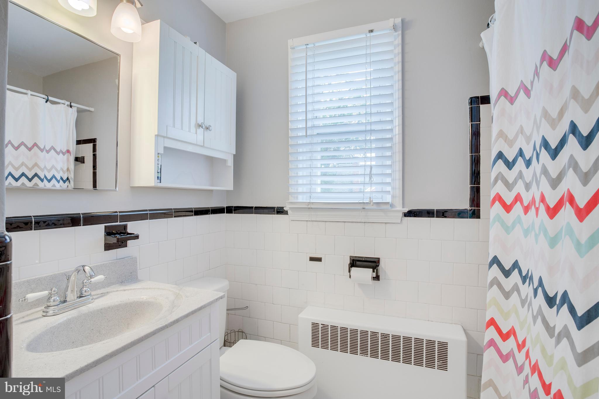 2105 Old Frederick Road Baltimore, MD 21228 - Photo 12 of 21 Retro bath with new vanity & freshly painted