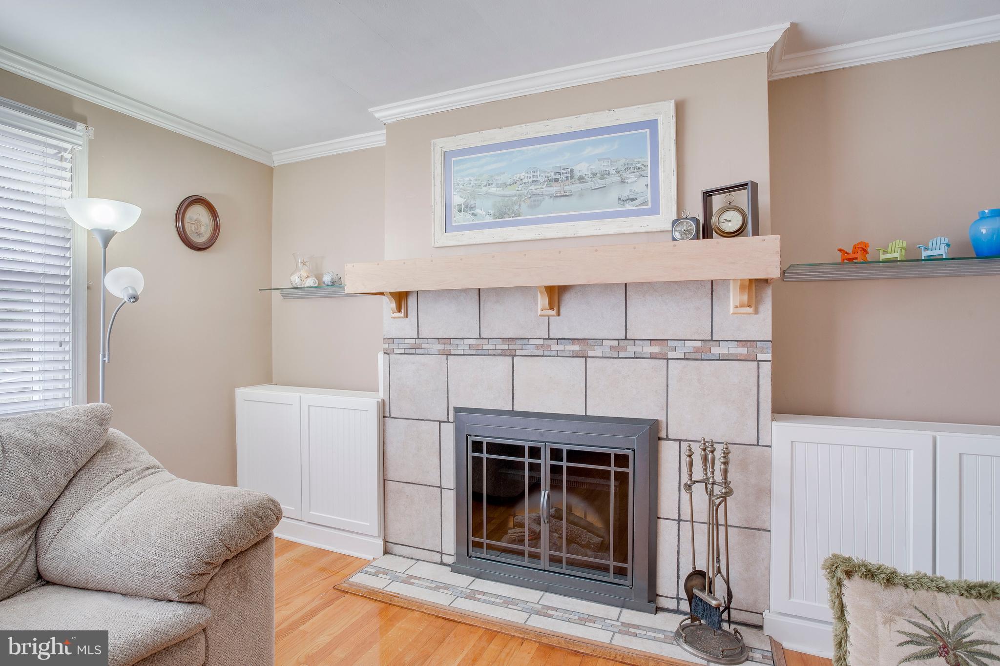 2105 Old Frederick Road Baltimore, MD 21228 - Photo 8 of 21 Modern fireplace & built-in storage