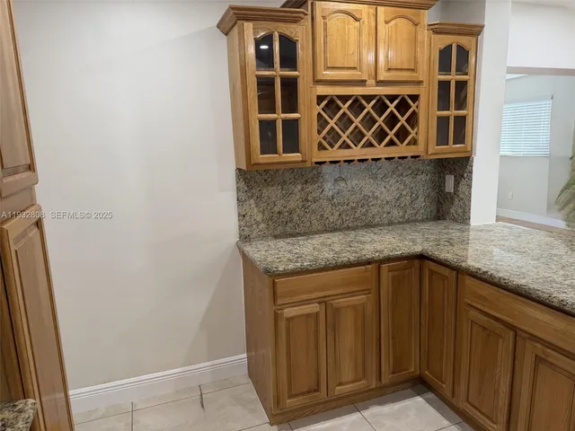 a kitchen with granite countertop a sink and a granite counter tops
