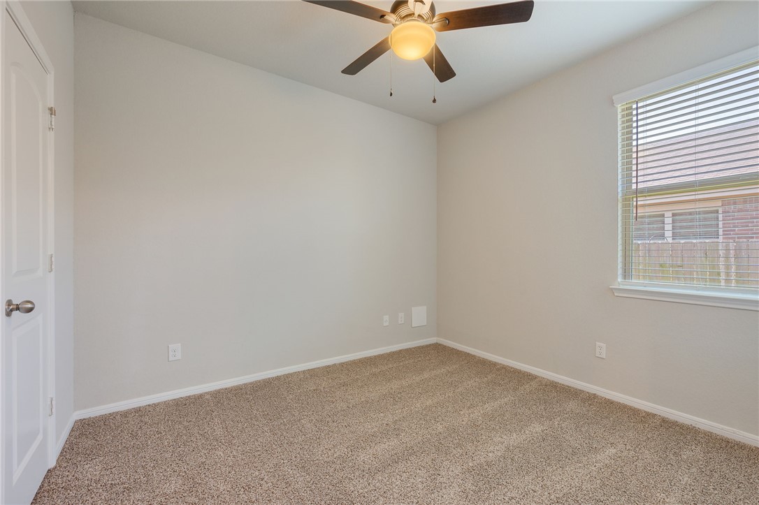 1700 Eagle View Drive Navasota, TX 77868 - Photo 15 of 22 an empty room with a window and a fan