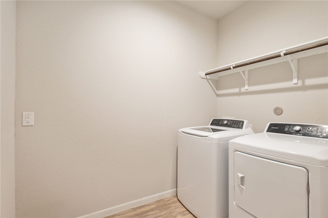 1700 Eagle View Drive Navasota, TX 77868 - Photo 17 of 22 a utility room with dryer and washer